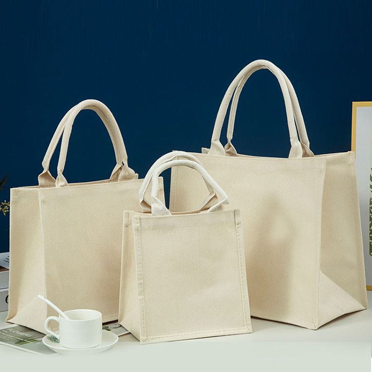 What are the advantages of using canvas tote bags instead of plastic bags?